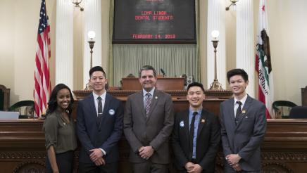 Assemblymember Wood with Loma Linda Dental Students on Assembly Floor - Close Up