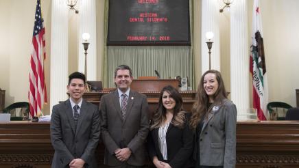 Assemblymember Wood with Western Dental Students on Assembly Floor - Close Up