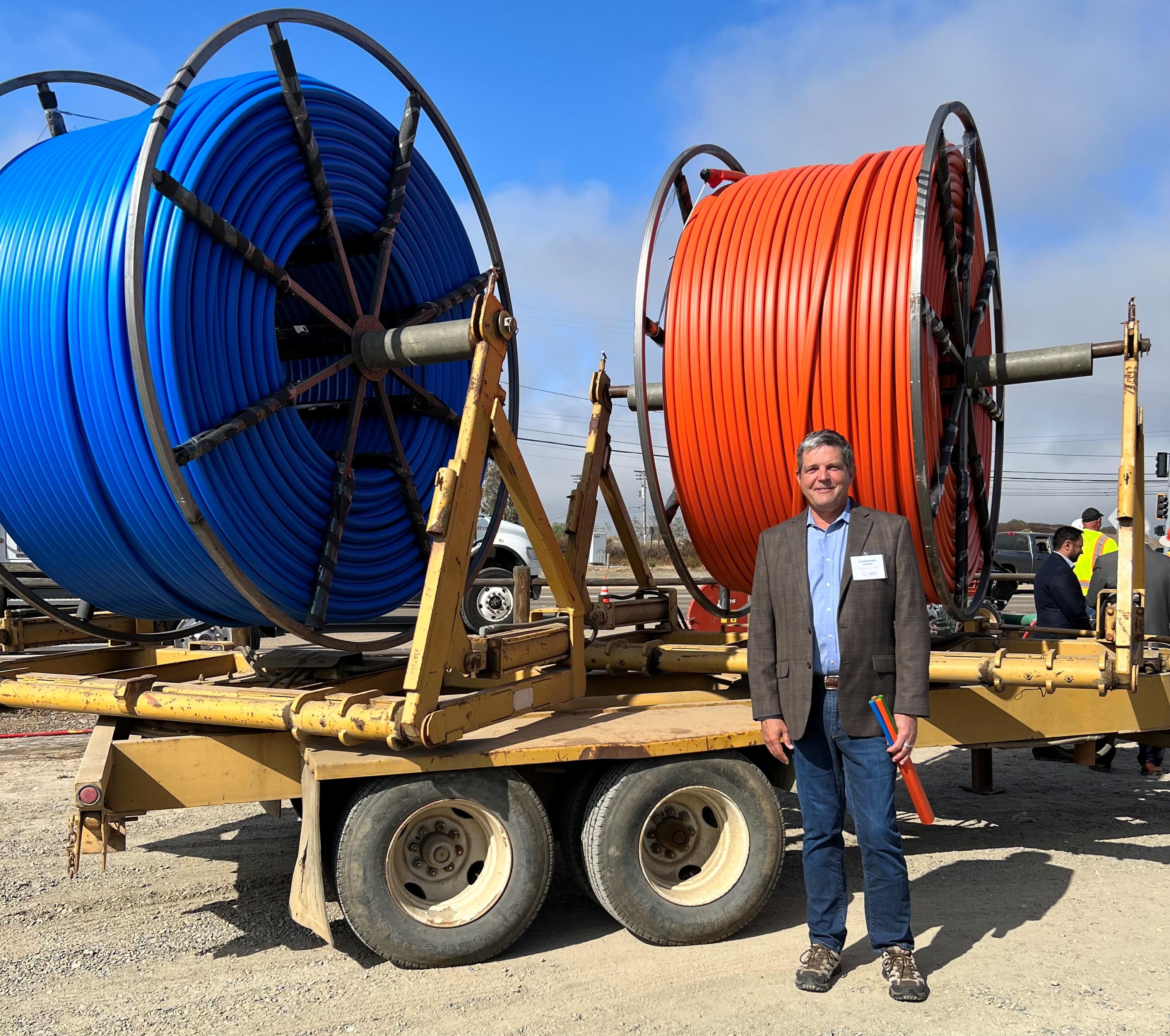 Assemblymember Jim Wood stands in front of miles of fiber optic cable