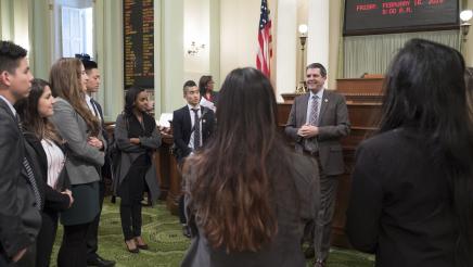 Assemblymember Wood Speaks with Dental Students on the Assembly Floor